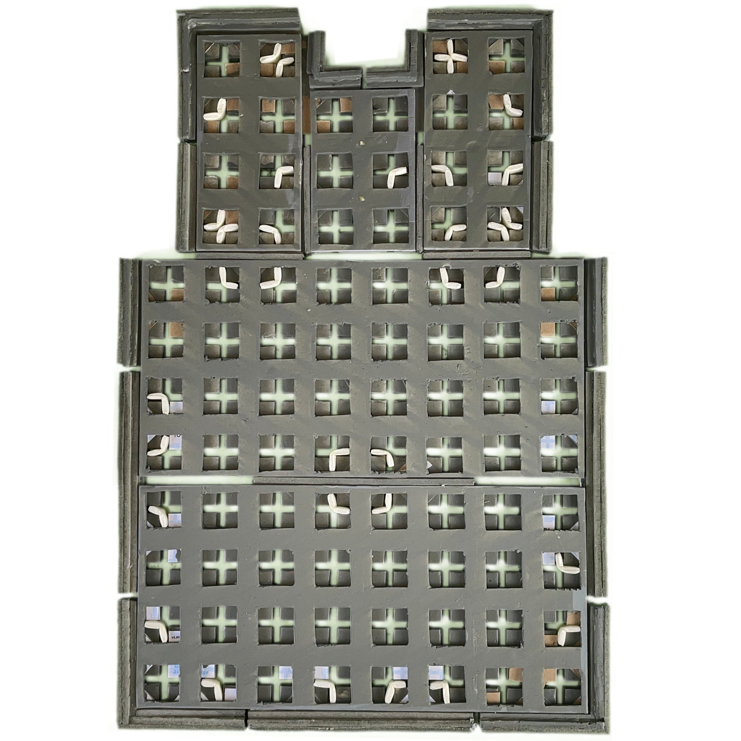 Hidden plugs connect together floor sections using TERRAINO Tabletop Terrain Modular Floor tiles.